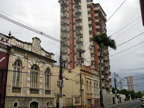 19th century low-rise structures, often covered in graffiti, sit side by side with typical highrise apartments.