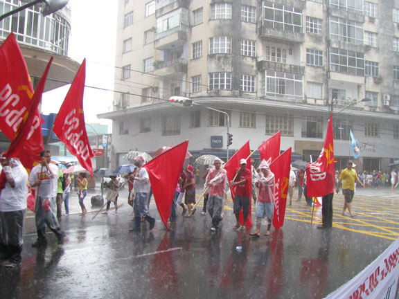 Soggy socialists march under a downpour, Jan. 26, 2009, Belem, Brazil, opening the World Social Forum.