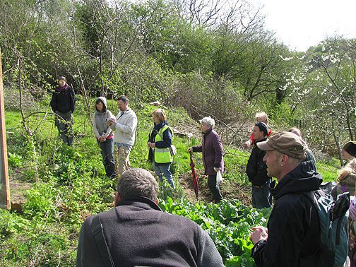 We listen in a semicircle up the hill before entering the "poly tube".