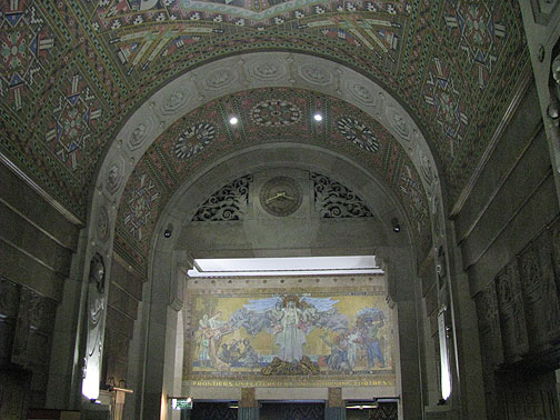 The lobby is full of Indian motif deco and some mosaic murals... through the arc the slogan on the mural says: "Frontiers Unfettered by any Frowning Fortress."