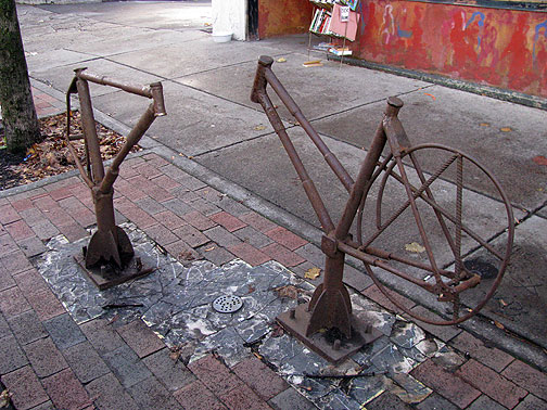 Cool rusting bike racks in front of Rust Belt Books.