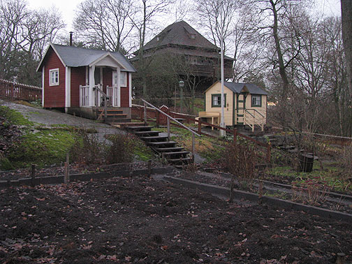 In Skansen museum, these are allotment huts, aka community gardens with small shacks, one from WWI era and the other from the 1940s.