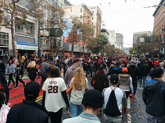 Giants fans clog Market Street after victory parade on Halloween.