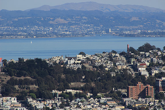 Weird view of Potrero Hill in the foreground and the Oakland Coliseum in the distance in the East Bay.