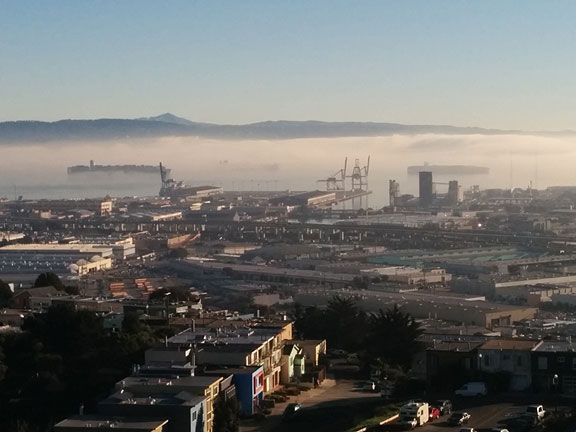 On my first back from vacation yesterday morning I went up Bernal Heights in bright sun to find that the bay was engulfed in low-lying fog. So beautiful! Here are some ships at anchor, emerging ghostly from the fog with Mt. Diablo in the far distance behind the Oakland hills.