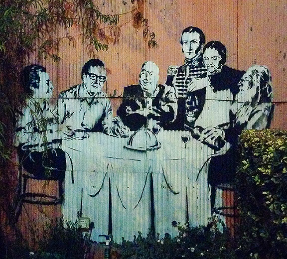 This stencil is at the top of the block with the trees in the street, featuring giants of Chilean culture: (l to r) Gabriela Mistral, Salvador Allende, Pablo Neruda, Manuel Rodriguez, Violeta Parra, and Clotario Blest.