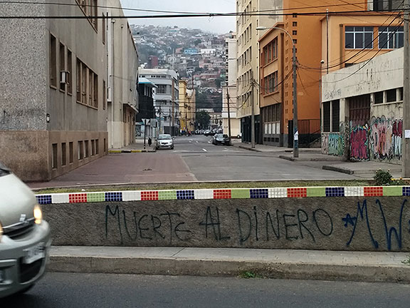 "Death to money" graffiti on coastal boulevard in Valparaiso.